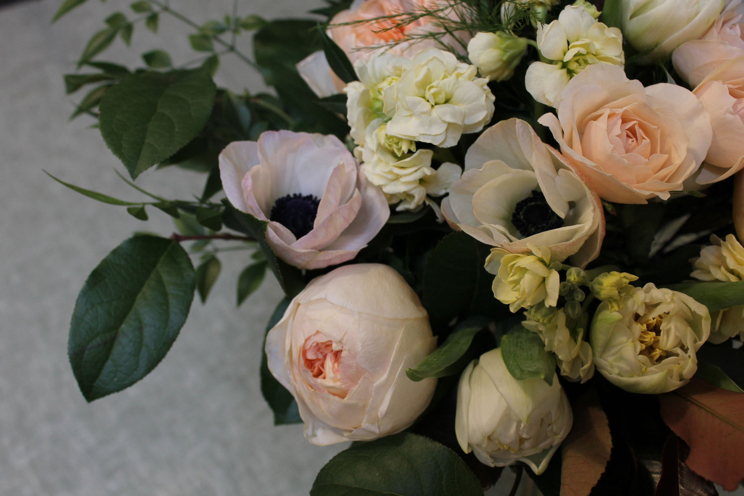 peach and white flowers in a bouquet